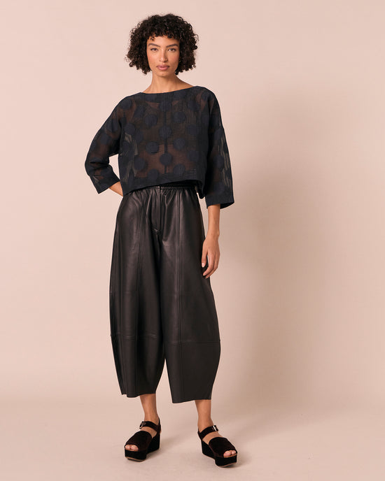 model wears lily black sheer spot top