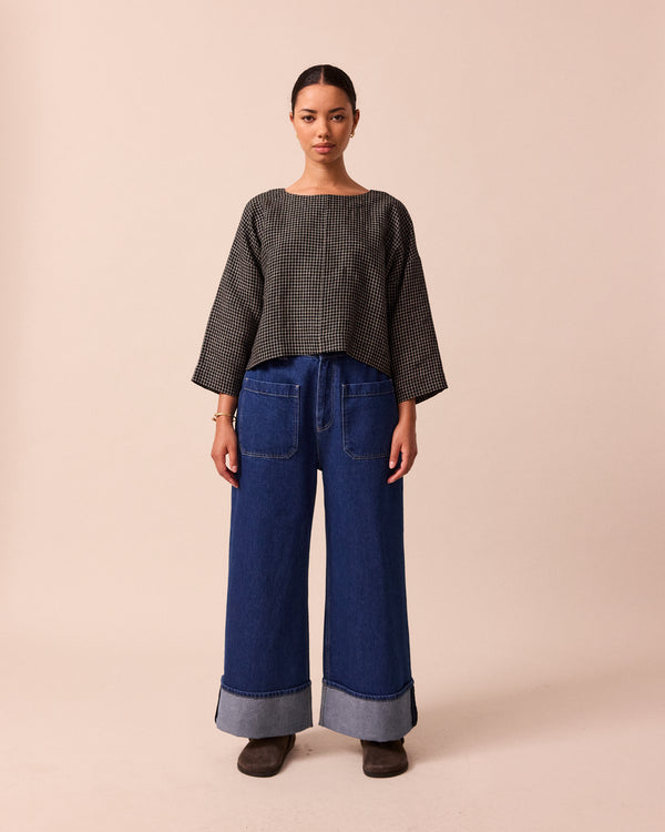 model wears lily black mini grid linen top