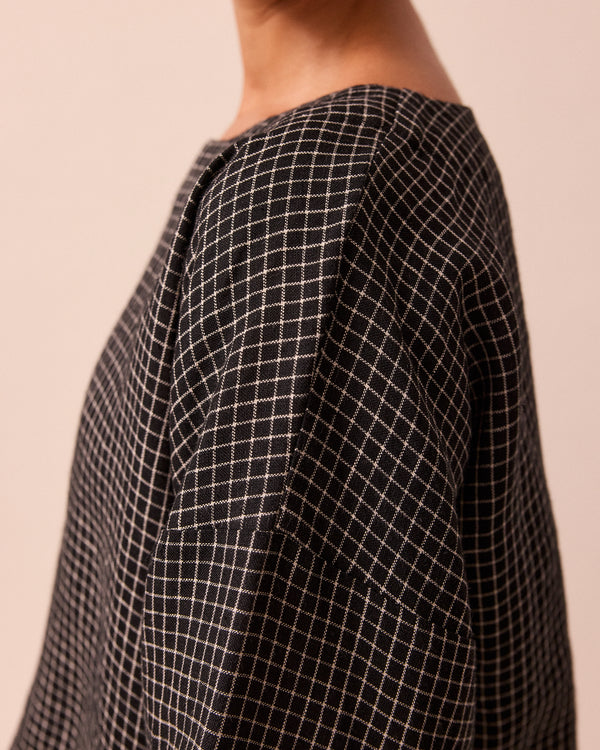 model wears lily black mini grid linen top