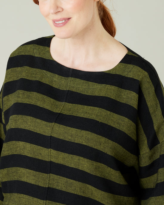 pregnant model wear olive and black stripe linen lily top