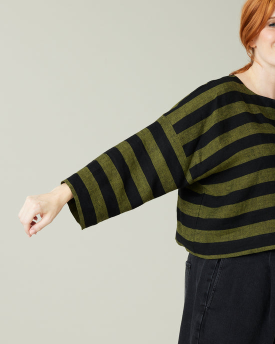 pregnant model wear olive and black stripe linen lily top