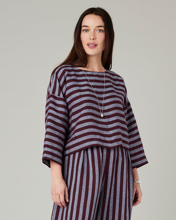 model wears lily cassis stripe linen top