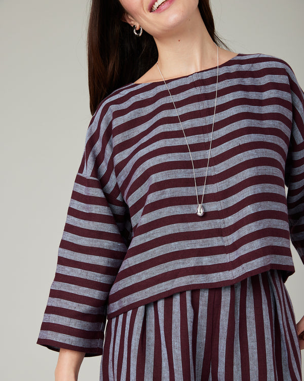 model wears lily cassis stripe linen top