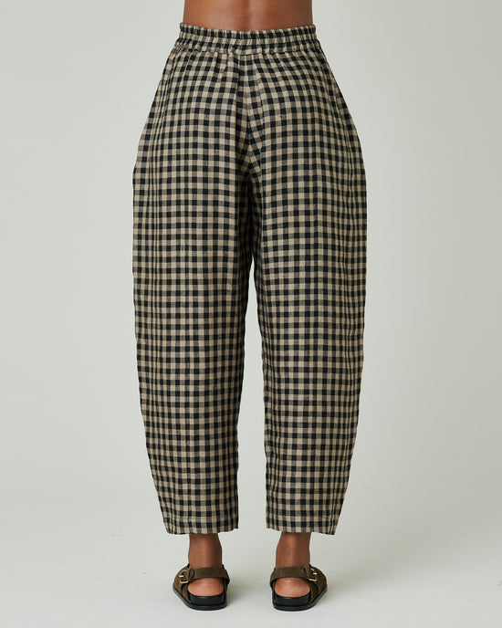 model wears coffee gingham mabel trousers back