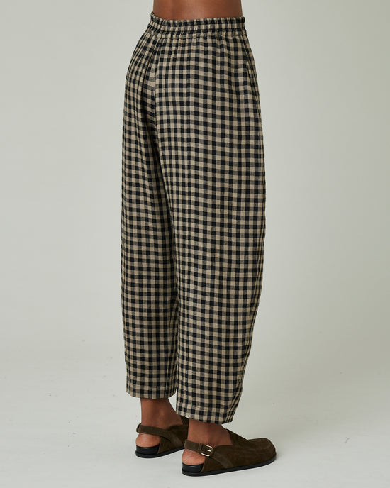 model wears coffee gingham mabel trousers right