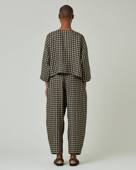 model wears coffee gingham mabel trousers 