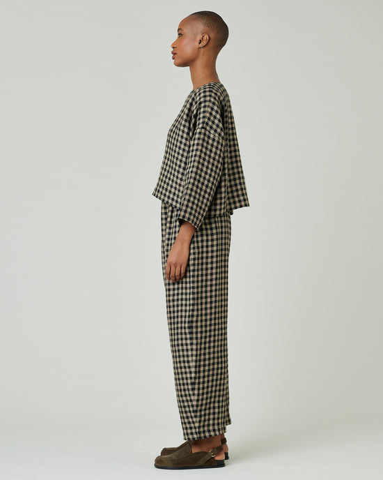 model wears coffee gingham mabel trousers 