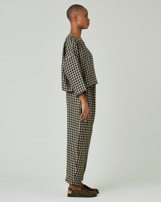 model wears coffee gingham mabel trousers 