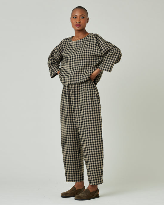 model wears coffee gingham mabel trousers 