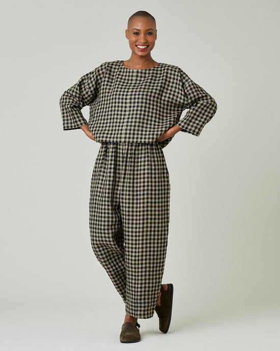 model wears coffee gingham mabel trousers 