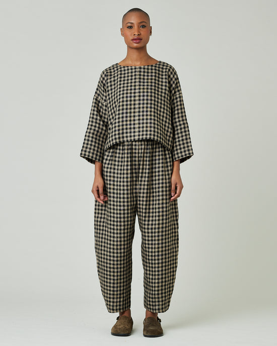 model wears coffee gingham mabel trousers 