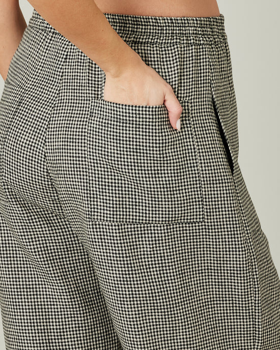 pregnant model wears huxley linen in black and stone micro gingham detail 