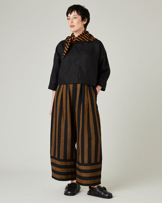 model wears rust stripe bobbi trousers 