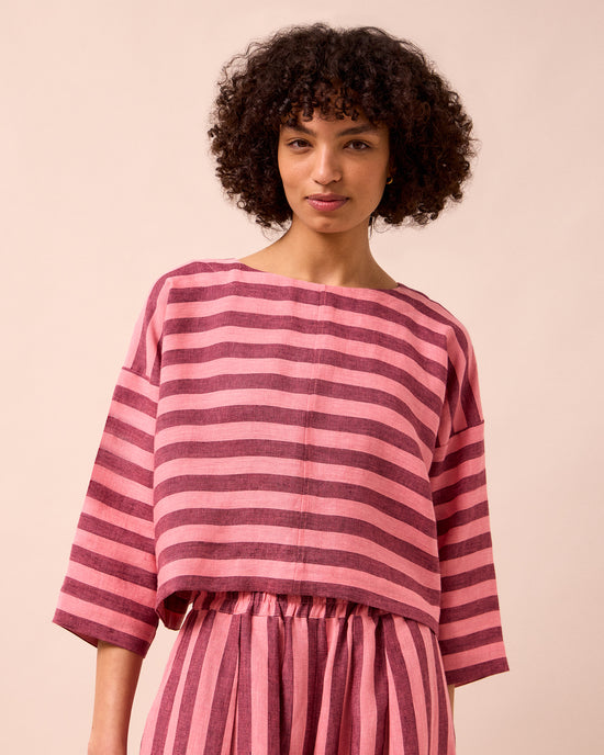 model wears lily fiesta pink linen top