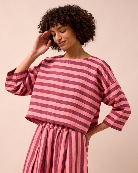 model wears lily fiesta pink linen top