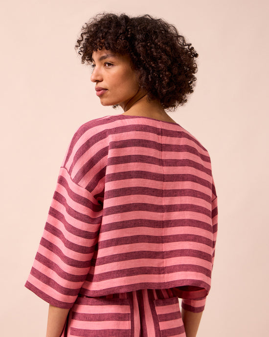 model wears lily fiesta pink linen top