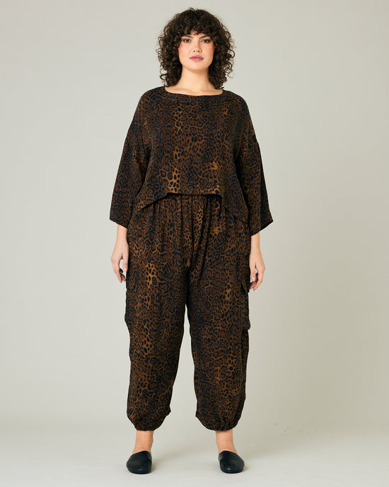 model wears dark leopard cupro sylvie trousers