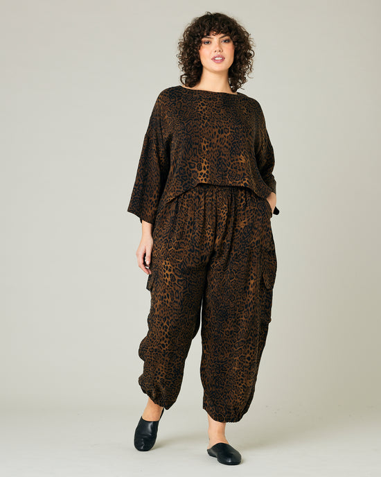 model wears dark leopard cupro sylvie trousers