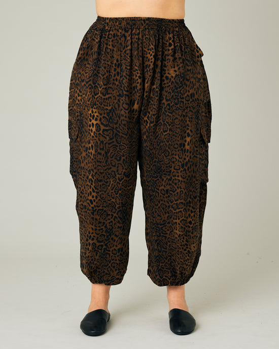 model wears dark leopard cupro sylvie trousers