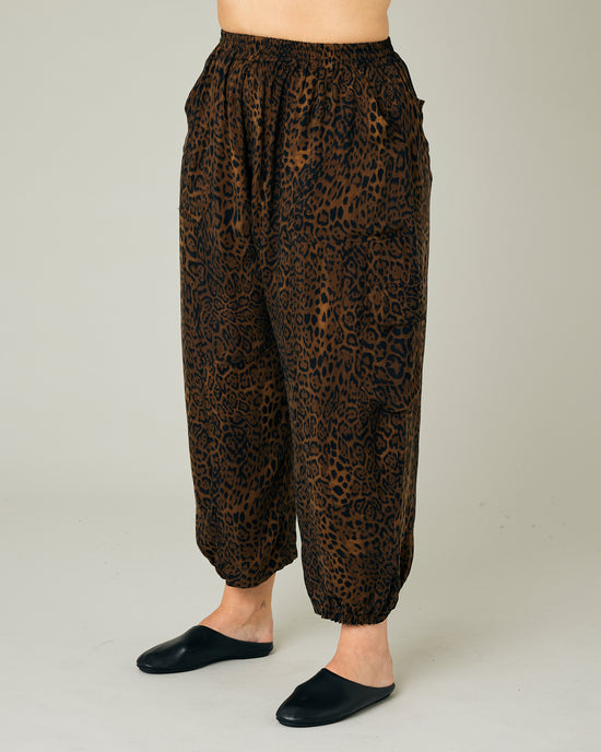 model wears dark leopard cupro sylvie trousers