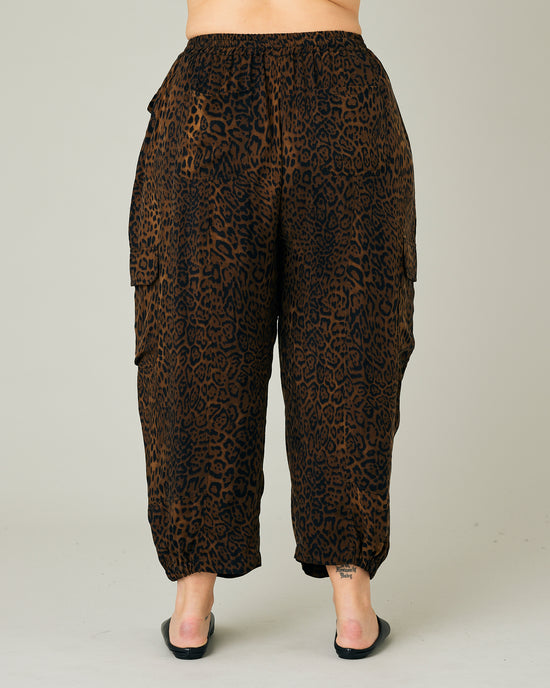 model wears dark leopard cupro sylvie trousers