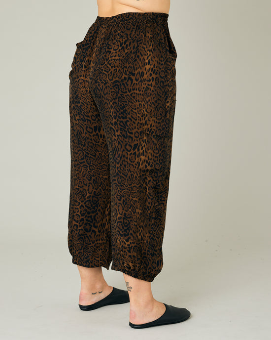 model wears dark leopard cupro sylvie trousers