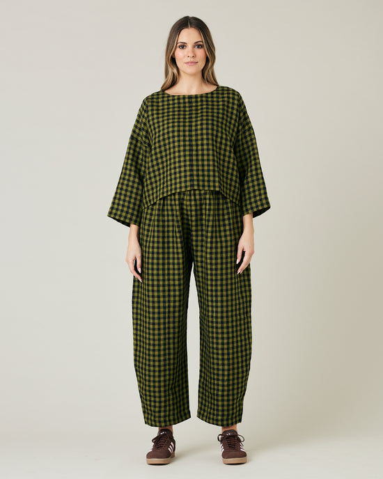 pregnant model wears green gingham linen mabel trousers from the front