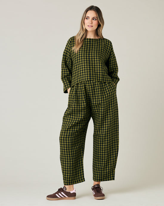 pregnant model wears green gingham linen mabel trousers from the front