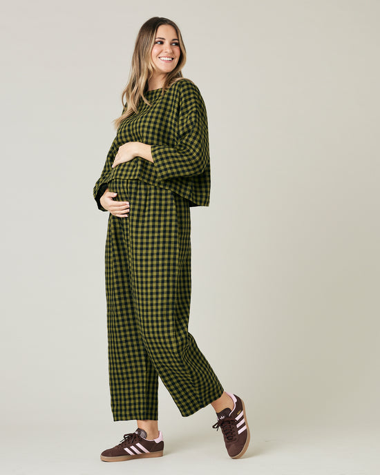 pregnant model wears green gingham linen mabel trousers from the front