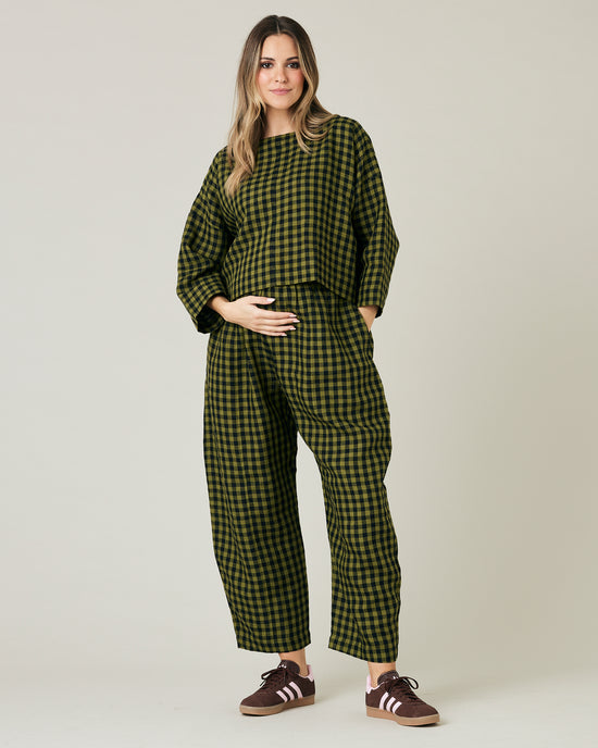 pregnant model wears green gingham linen mabel trousers from the front