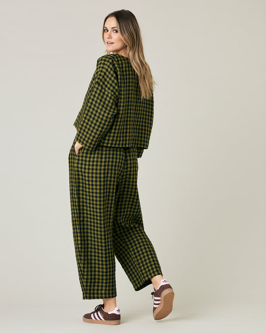 pregnant model wears green gingham linen mabel trousers from the front