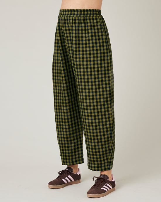 pregnant model wears green gingham linen mabel trousers from the front