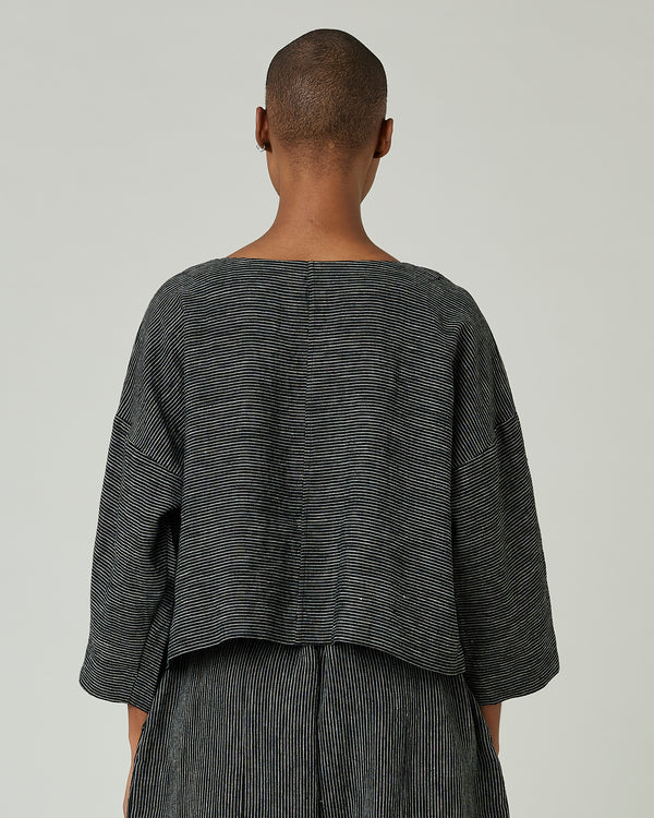 model wears black and ecru pencil stripe lily top 