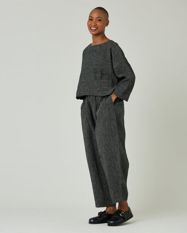 model wears black and ecru pencil stripe lily top 