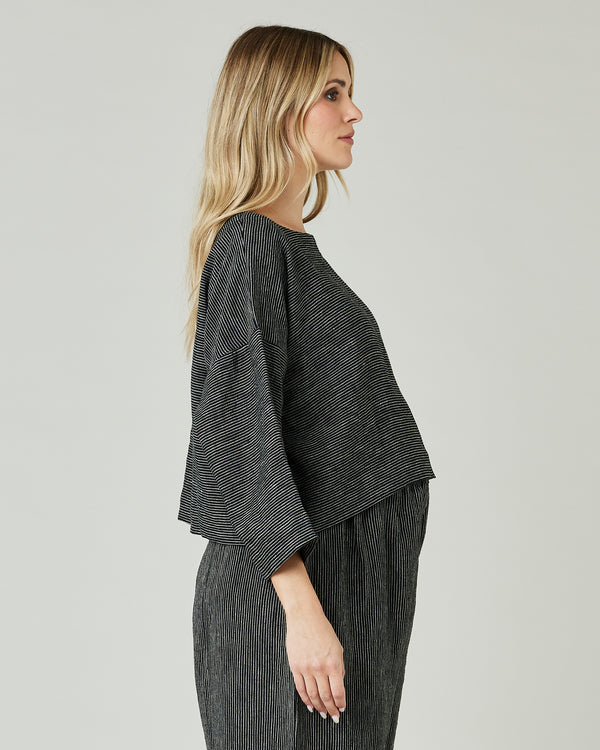 pregnant model wears black and ecru pencil stripe lily top 