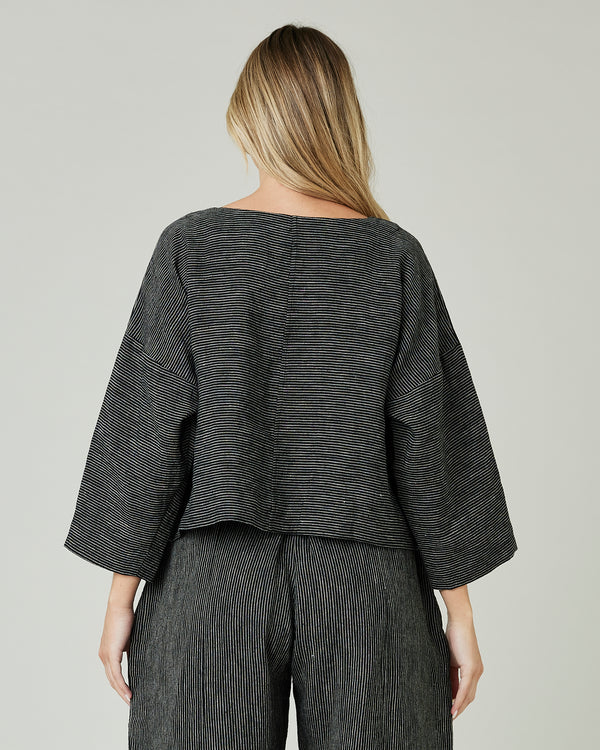 pregnant model wears black and ecru pencil stripe lily top 