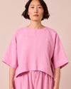 model wears lisa rose pink linen top