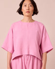 model wears lisa rose pink linen top