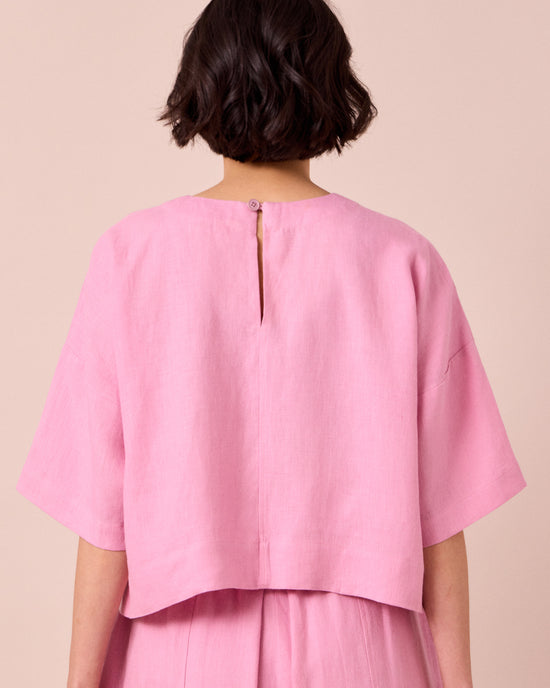 model wears lisa rose pink linen top