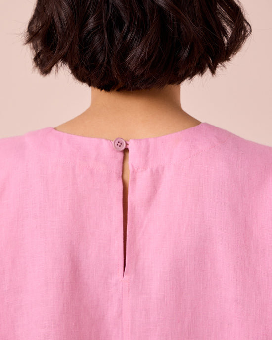 model wears lisa rose pink linen top