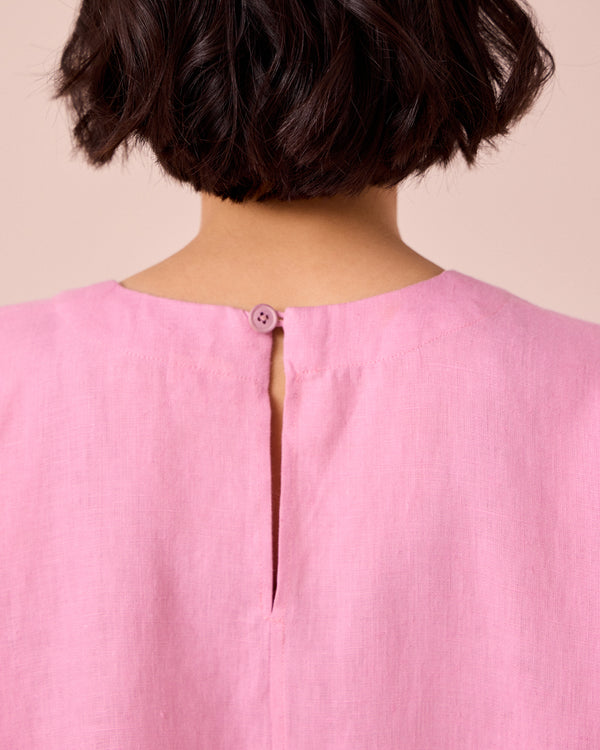 model wears lisa rose pink linen top