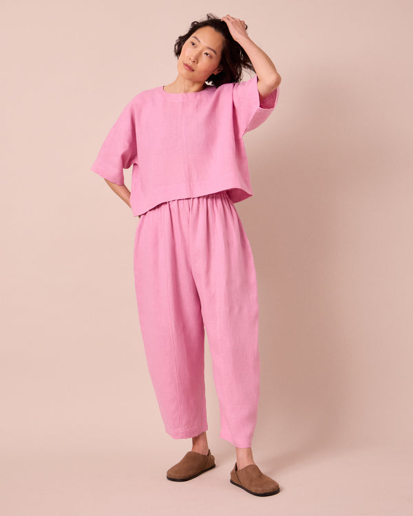model wears lisa rose pink linen top