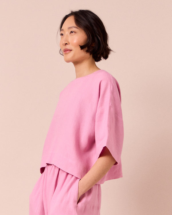 model wears lisa rose pink linen top