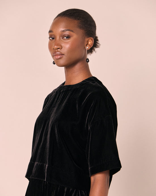 model wears the lisa black velvet top