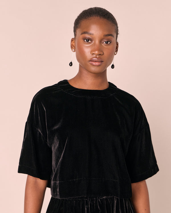 model wears the lisa black velvet top