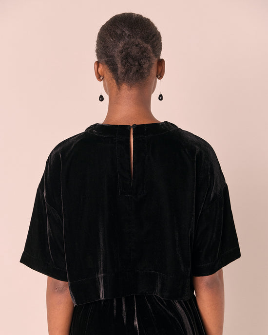 model wears the lisa black velvet top