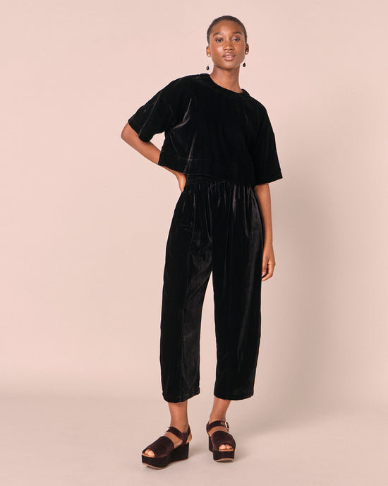 model wears the lisa black velvet top
