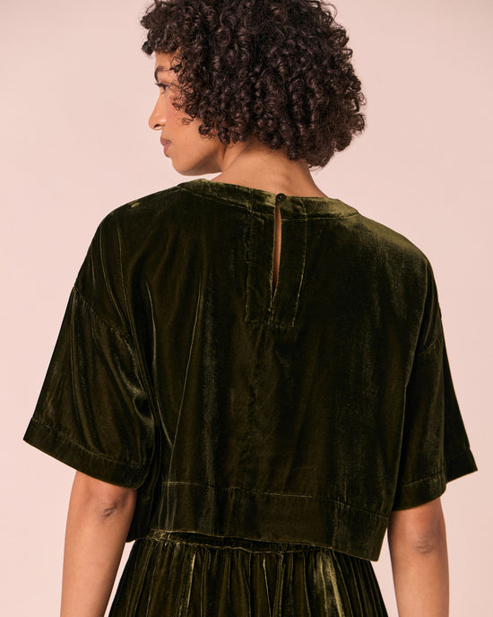 model wears lisa moss green velvet top