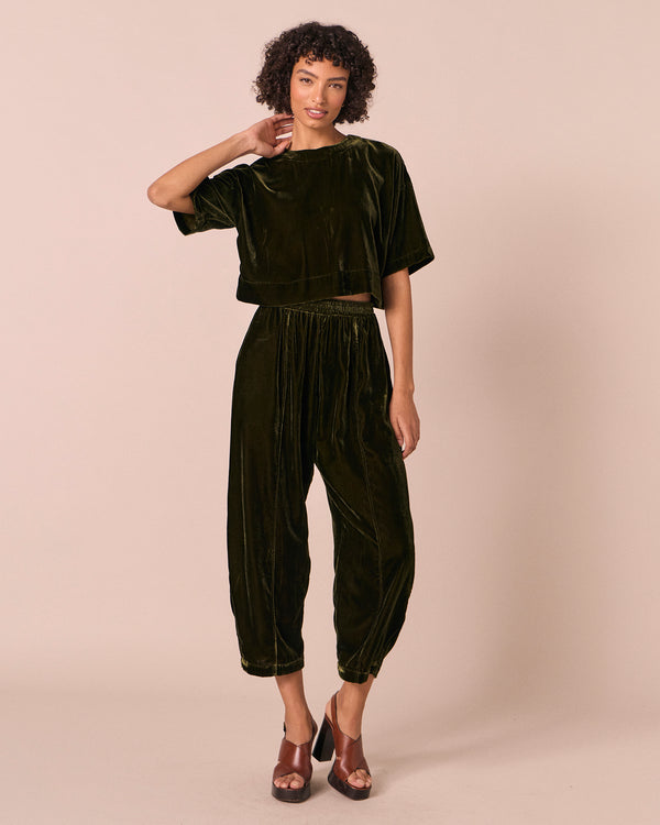 model wears lisa moss green velvet top