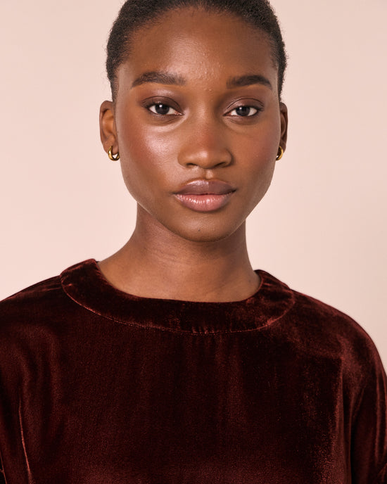model wears lisa umber velvet top
